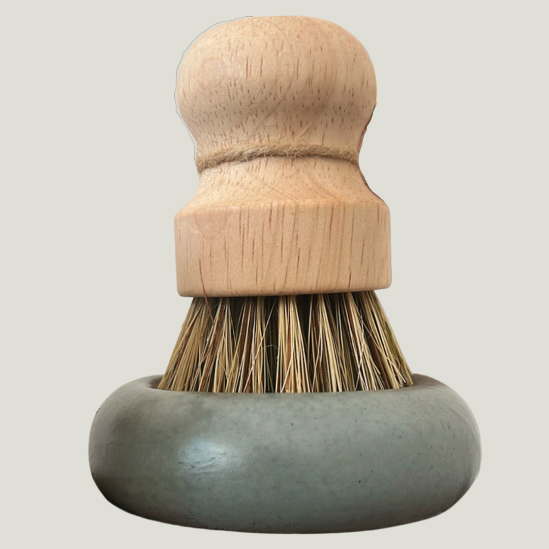 wooden dish brush and concrete dish